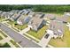 An aerial perspective of a residential area, illustrating the layout and landscaping at 125 Alumroot Rd, Holly Springs, NC 27540