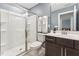 Modern bathroom featuring a glass enclosed shower and sleek vanity at 125 Alumroot Rd, Holly Springs, NC 27540