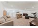 Large bonus room with couches, desk, and exercise equipment at 125 Alumroot Rd, Holly Springs, NC 27540
