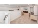 Light filled bonus room features neutral carpeting, a TV, and a treadmill at 125 Alumroot Rd, Holly Springs, NC 27540