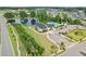Community center featuring a refreshing pool and recreational facilities near a serene pond at 125 Alumroot Rd, Holly Springs, NC 27540