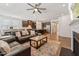 Spacious living room showcases an open floorplan and a view of the modern kitchen at 125 Alumroot Rd, Holly Springs, NC 27540