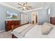 Comfortable main bedroom with a TV, ceiling fan, closet and en-suite bathroom at 125 Alumroot Rd, Holly Springs, NC 27540