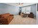 Bright office with blue walls, a comfortable couch, and multiple monitors at 125 Alumroot Rd, Holly Springs, NC 27540