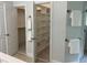 Bathroom showing and walk-in closets with built-in shelving for optimal storage at 1276 Dalgarven Dr, Apex, NC 27502