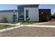 Exterior of a building featuring large windows, a ramp, and landscaping at 1276 Dalgarven Dr, Apex, NC 27502