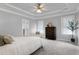 Main bedroom with tray ceilings, natural light, and neutral colors at 1276 Dalgarven Dr, Apex, NC 27502