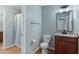 Traditional bathroom featuring a shower and tub combo and wood vanity at 145 Mariah Towns Way, Garner, NC 27529