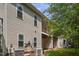 View of the back of the house, showing siding, windows, a deck, and air conditioning units at 145 Mariah Towns Way, Garner, NC 27529