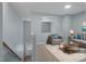 Comfortable living room featuring plush seating, a modern coffee table, and neutral décor at 145 Mariah Towns Way, Garner, NC 27529