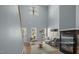 Staged living room featuring hardwood floors, a fireplace, tall ceilings, and plenty of natural light at 145 Mariah Towns Way, Garner, NC 27529