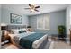 Elegant main bedroom boasts a large bed, stylish decor, and abundant natural light at 145 Mariah Towns Way, Garner, NC 27529