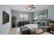 Elegant main bedroom boasts a large bed, stylish decor, and abundant natural light at 145 Mariah Towns Way, Garner, NC 27529