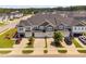 An aerial view of the modern townhome community with sidewalks and attractive landscaping at 150 Gosford Ln, Garner, NC 27529