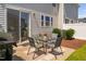 Cozy backyard patio with a glass table, four chairs, grill, and privacy fence at 150 Gosford Ln, Garner, NC 27529