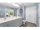 Stylish bathroom featuring double sinks, framed mirror, sleek fixtures and plenty of storage at 150 Gosford Ln, Garner, NC 27529