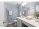 Well-lit bathroom with a shower, large vanity, and modern fixtures at 150 Gosford Ln, Garner, NC 27529