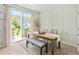 Bright dining room featuring a sliding glass door to the patio and backyard at 150 Gosford Ln, Garner, NC 27529