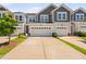 Charming townhome with a two-car garage and a well-manicured lawn in a desirable neighborhood at 150 Gosford Ln, Garner, NC 27529