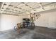 Spacious two car garage with bike racks and storage shelves for tools and supplies at 150 Gosford Ln, Garner, NC 27529