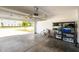 Spacious garage with storage shelves, bicycle, and an automatic door opener system at 150 Gosford Ln, Garner, NC 27529