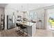 Modern kitchen with granite countertops, stainless steel appliances, and an island with bar seating at 150 Gosford Ln, Garner, NC 27529