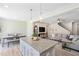 Open concept kitchen with pendant lighting, dining area and living room at 150 Gosford Ln, Garner, NC 27529