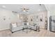 Relaxing living room with comfortable sectional sofa, ceiling fan, and stylish decor at 150 Gosford Ln, Garner, NC 27529