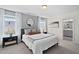 Comfortable primary bedroom with a walk-in closet and plenty of natural light at 150 Gosford Ln, Garner, NC 27529