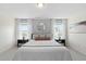 Bright main bedroom with two large windows, and comfortable neutral decor at 150 Gosford Ln, Garner, NC 27529