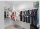 Spacious walk-in closet with shelving to easily organize clothes and accessories at 150 Gosford Ln, Garner, NC 27529