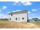 Exterior view of the back of the home with a patio and yard at 16 Powder Ct, Angier, NC 27501