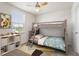 bedroom with a charming bunk bed, playful décor, and a window with a pleasant view at 16 Powder Ct, Angier, NC 27501