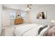 Comfortable bedroom features neutral tones, dresser, and large windows for ample natural light at 16 Powder Ct, Angier, NC 27501