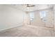A spacious bedroom is brightened by natural light and a modern ceiling fan at 16 Powder Ct, Angier, NC 27501