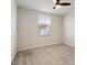 Cozy bedroom with neutral carpet, bright window and modern ceiling fan at 16 Powder Ct, Angier, NC 27501