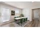 Bright dining room with modern marble table and seating, complemented by light wood flooring at 16 Powder Ct, Angier, NC 27501