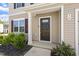 Charming front entrance with neat landscaping and well-maintained home exterior at 16 Powder Ct, Angier, NC 27501