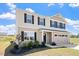 Charming two-story home with neatly landscaped front yard at 16 Powder Ct, Angier, NC 27501