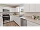 Bright kitchen boasts stainless steel appliances and granite countertops at 16 Powder Ct, Angier, NC 27501