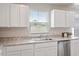 Modern kitchen featuring stainless steel appliances and granite countertops at 16 Powder Ct, Angier, NC 27501