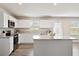 Modern kitchen with white cabinets, granite countertops, stainless steel appliances and center island at 16 Powder Ct, Angier, NC 27501