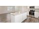 Modern kitchen island overlooks the living room with stainless steel appliances at 16 Powder Ct, Angier, NC 27501