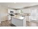 Well-lit kitchen with stainless steel appliances and a granite center island at 16 Powder Ct, Angier, NC 27501