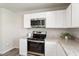 Clean kitchen features stainless steel appliances and granite countertops at 16 Powder Ct, Angier, NC 27501