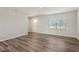 Spacious living room with hardwood floors and a window at 16 Powder Ct, Angier, NC 27501