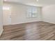 Clean, modern living room with hardwood floors and a door at 16 Powder Ct, Angier, NC 27501
