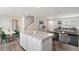 Open concept living room flows into kitchen, featuring a center island and dining area at 16 Powder Ct, Angier, NC 27501