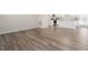 Open living room with hardwood floors and bright lighting at 16 Powder Ct, Angier, NC 27501