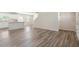 Open-concept living space with hardwood floors and bright lighting at 16 Powder Ct, Angier, NC 27501